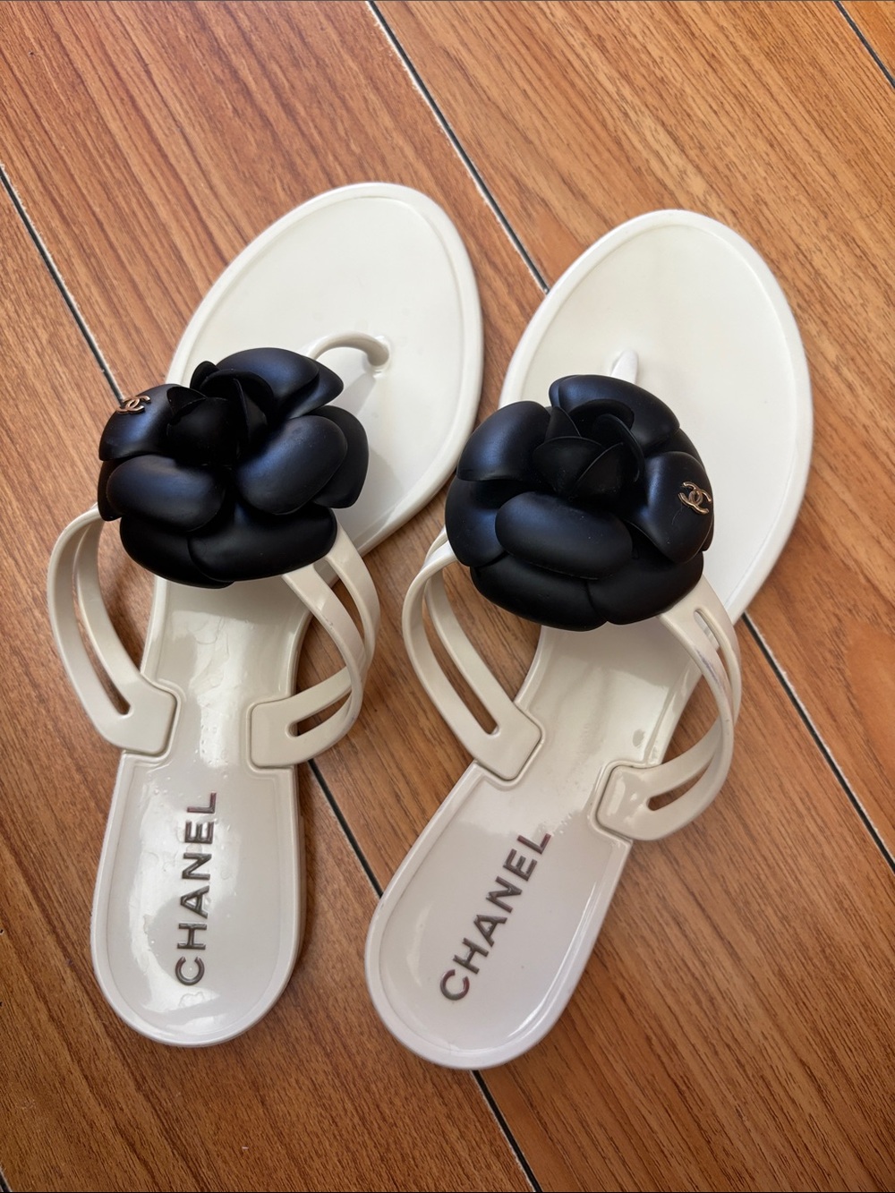 CHANEL Ivory Jelly Thong Sandals with Black Camellia Flower